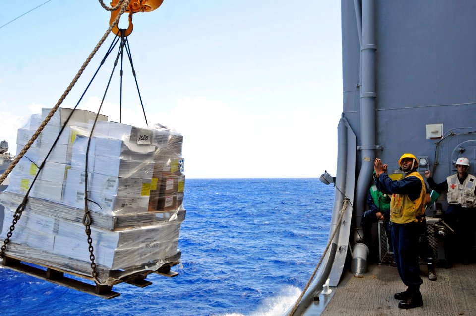 US Navy 110916-N-RC734-245 Boatswain's Mate 2nd Class Sheraul Gumbs signals USNS John Ericsson (T-AO 194) during a connected replenishment aboard U