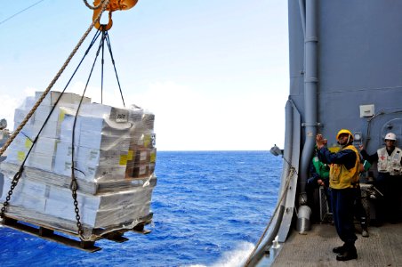US Navy 110916-N-RC734-245 Boatswain's Mate 2nd Class Sheraul Gumbs signals USNS John Ericsson (T-AO 194) during a connected replenishment aboard U