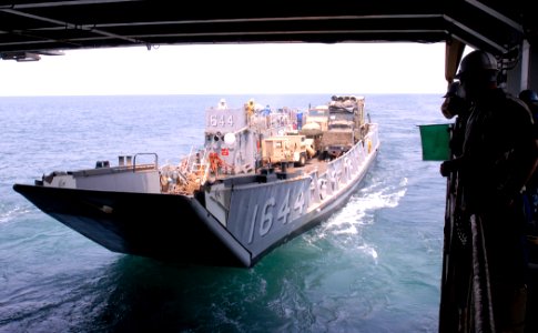 US Navy 110920-N-GH121-058 A landing craft utility (LCU) assigned to Assault Craft Unit (ACU) 2 departs the well deck of the amphibious dock landin