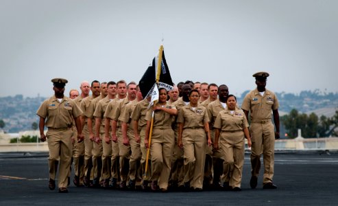 US Navy 110916-N-TZ605-028 Chief petty officer selects march in formation during the 2011 chief petty officer pinning ceremony aboard USS Carl Vins photo