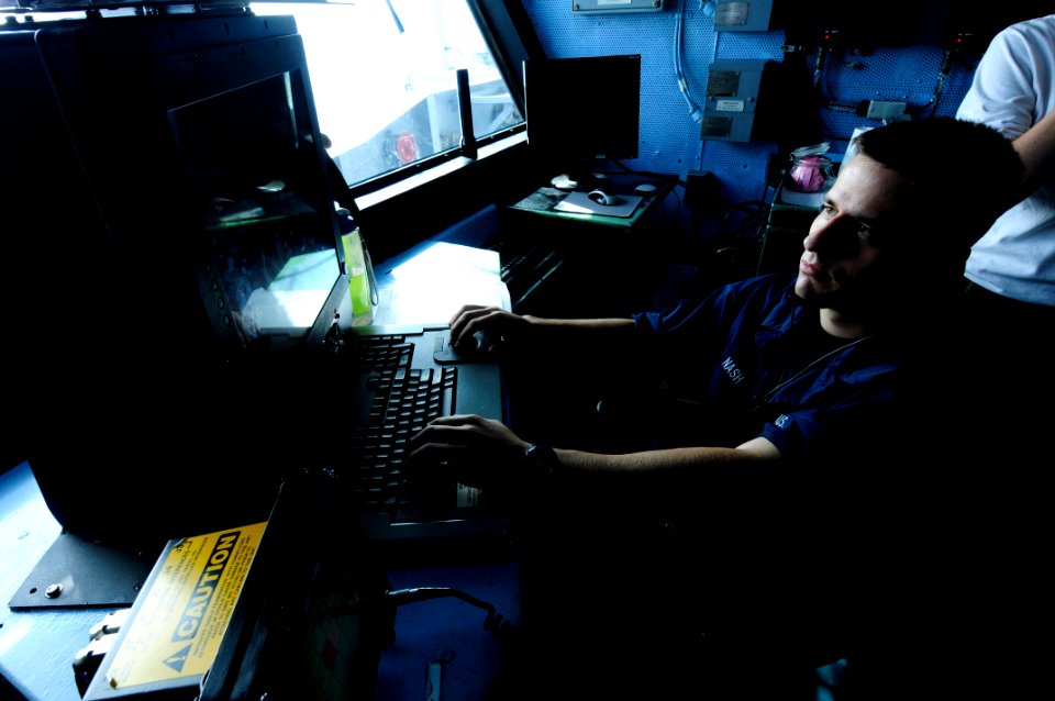 US Navy 110920-N-JO245-014 Aviation Boatswain's Mate (Handling) Airman Leland Nash, from Portland, Ore., updates the status of aircraft as the inte