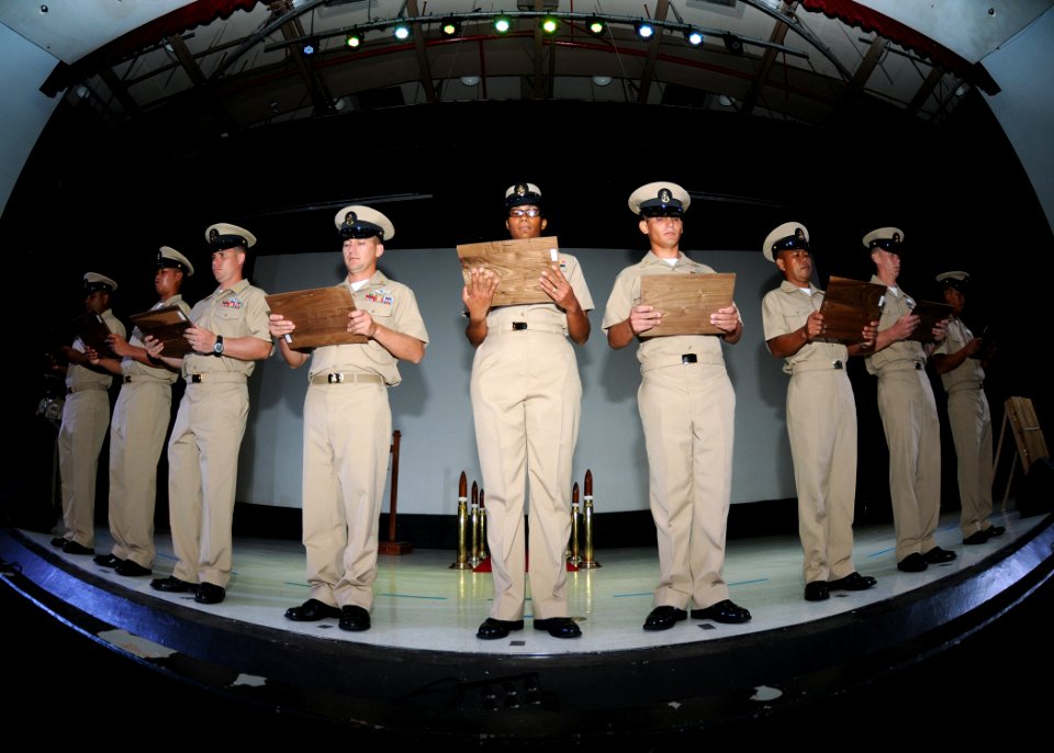 US Navy 110916-N-BK435-161 Newly pinned chief petty officers assigned to the submarine tender USS Frank Cable (AS 40) listen to the