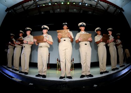 US Navy 110916-N-BK435-161 Newly pinned chief petty officers assigned to the submarine tender USS Frank Cable (AS 40) listen to the