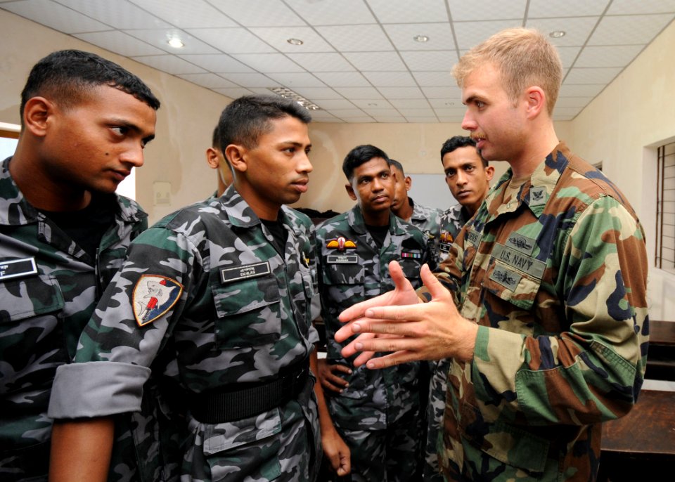 US Navy 110919-N-KK935-559 Engineman 2nd Class Benjamin Clemens, assigned to Riverine Squadron (RIVRON) 1, discuses riverine operations concepts wi