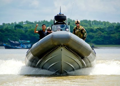 US Navy 110920-N-RI884-270 Members of a Bangladesh navy rigid-hull inflatable boat team train with U.S. Navy Sailors, right, from Riverine Squadron