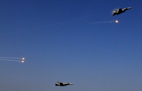 US Navy 110917-N-XE109-176 F-A-18A- Hornets release flares during an aerial change of command ceremony