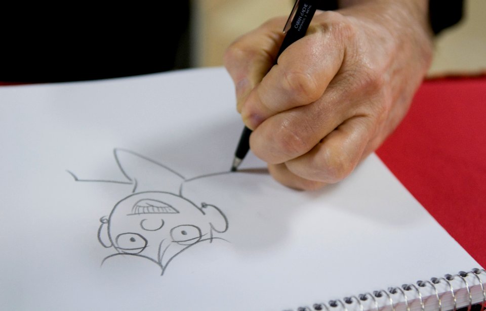 US Navy 110918-N-OK922-285 Greg Evans raws caricatures for Sailors as part of Navy Operational Stress Control aboard USS Carl Vinson (CVN 70)
