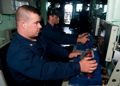 US Navy 110919-N-FI736-066 Gunner's Mate 3rd Class Sean Prior, left, and Gunners Mate 2nd Class Stanley Langley man the Mk 38 25mm machine gun syst