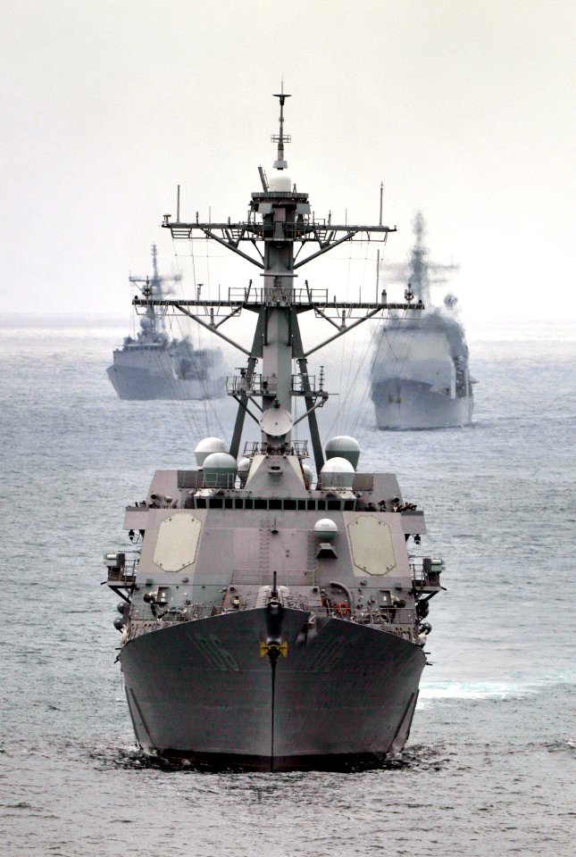 US Navy 110921-N-GZ277-069 The Arleigh Burke-class guided-missile destroyer USS Stockdale (DDG 106) leads the Ticonderoga-class guided-missile crui