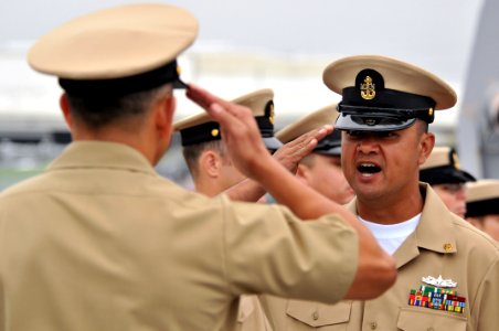 US Navy 110916-N-ZF681-306 Chief Gas Turbine System Technician (Mechanical) Anegelo Lobo requests permission from Command Master Chief Jose Caballe photo