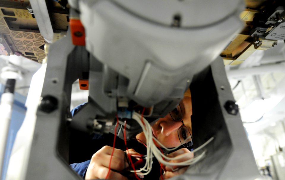 US Navy 110919-N-XE109-179 Aviation Electronics Technician Airman Christina N. Mace strips aircraft radar wires aboard the aircraft carrier USS Geo