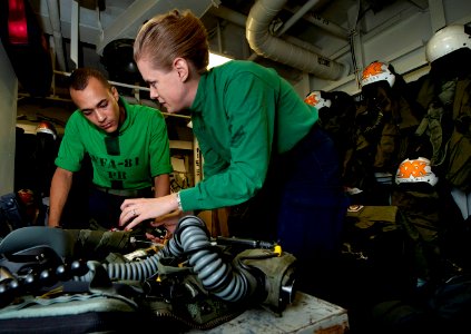US Navy 110920-N-DR144-048 Sailors perform a 90-day inspection on a pilot's CMU-36 survival vest