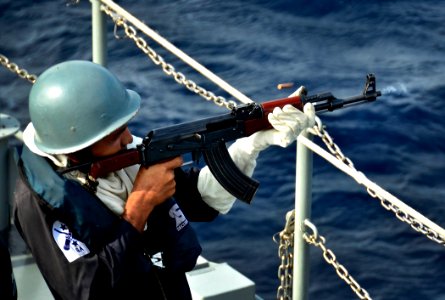 US Navy 110922-N-RI844-133 A Bangladesh navy sailor fires a Type-56 assault rifle aboard the Bangladesh navy frigate BNS Bangabandhu (F 25) during photo