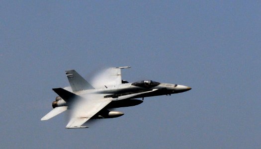 US Navy 110917-N-XE109-196 Cmdr. Christopher T. Petrock flies an F-A-18A- Hornet during an aerial change of command ceremony
