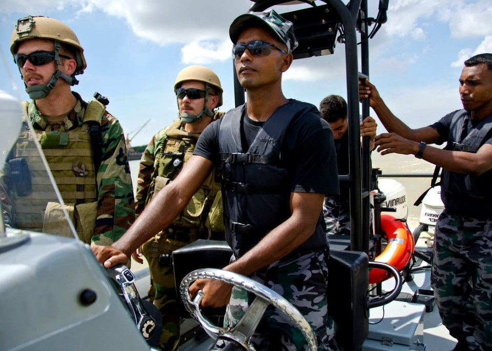 US Navy 110920-N-RI884-227 Members of a Bangladesh navy rigid-hull inflatable boat team train with U.S. Navy Sailors, left, from Riverine Squadron