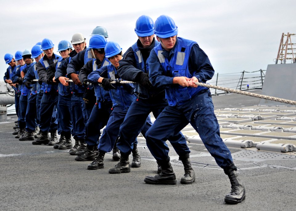 US Navy 110918-N-ZF681-266 Sailors heave a fuel line aboard the guided-missile destroyer USS Halsey (DDG 97) during a replenishment at sea