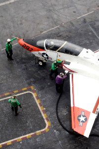 US Navy 110919-N-AU622-041 Sailors assigned to the air department aboard the aircraft carrier USS Dwight D. Eisenhower (CVN 69) refuel a T-45C Gosh