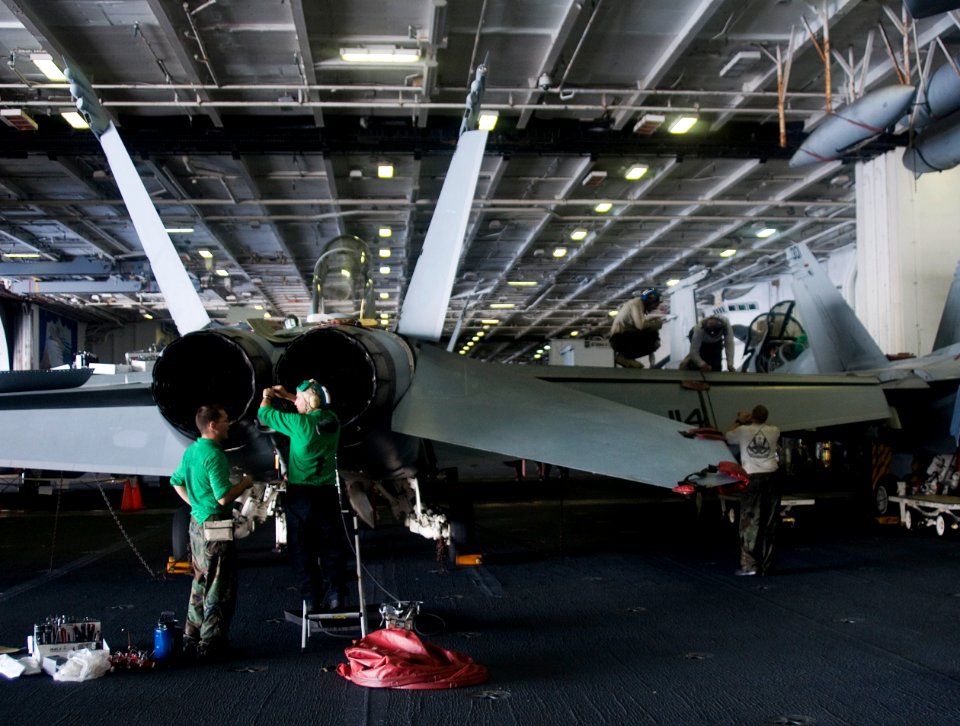 US Navy 110920-N-SF704-034 Sailors assigned to Strike Fighter Squadron (VFA) 102 perform maintenance an F-A-18F Super Hornet aboard the aircraft ca
