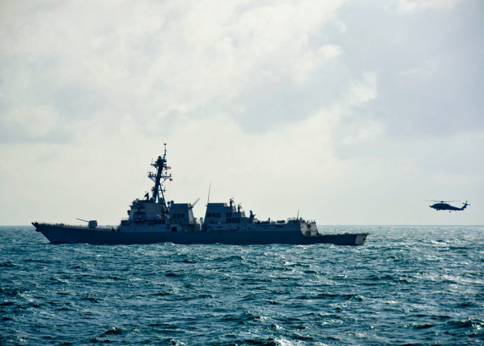 US Navy 110921-N-RI844-027 A U.S. Navy helicopter approaches the guided-missile destroyer USS Kidd (DDG 100) during exercises as part of Cooperatio