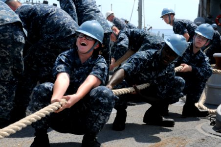 US Navy 110923-N-MW330-392 Seaman Brooke Haney, left, Seaman Recruit Travis Abankwah, and Seaman Recruit Dustin Davidson pull a line aboard the amp