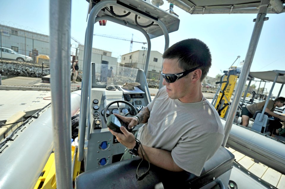 US Navy 110922-N-IR479-009 Explosive Ordnance Disposal Technician 2nd Class Casey Anderson, assigned to Task Group (TG) 56.1, inspects a global pos
