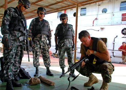 US Navy 110921-N-VP123-016 Electronics Technician 1st Class Anthony Nekervis, assigned to Maritime Civil Affairs Security Training Command, does fo