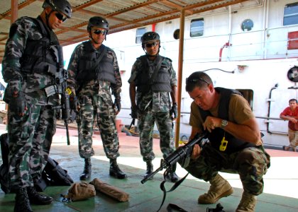 US Navy 110921-N-VP123-016 Electronics Technician 1st Class Anthony Nekervis, assigned to Maritime Civil Affairs Security Training Command, does fo photo