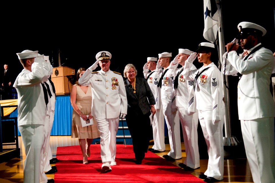 US Navy 110923-N-ZB612-123 Adm. Gary Roughead salutes the sideboys with his wife, Ellen, at the conclusion of the Chief of Naval Operations change