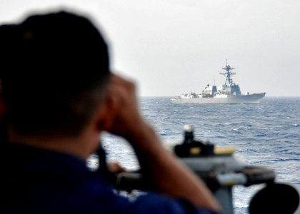 US Navy 110922-N-RI844-335 Bangladesh navy sailors aboard the Bangladesh navy frigate BNS Bangabandhu (F 25) observe maneuvers during a surface gun