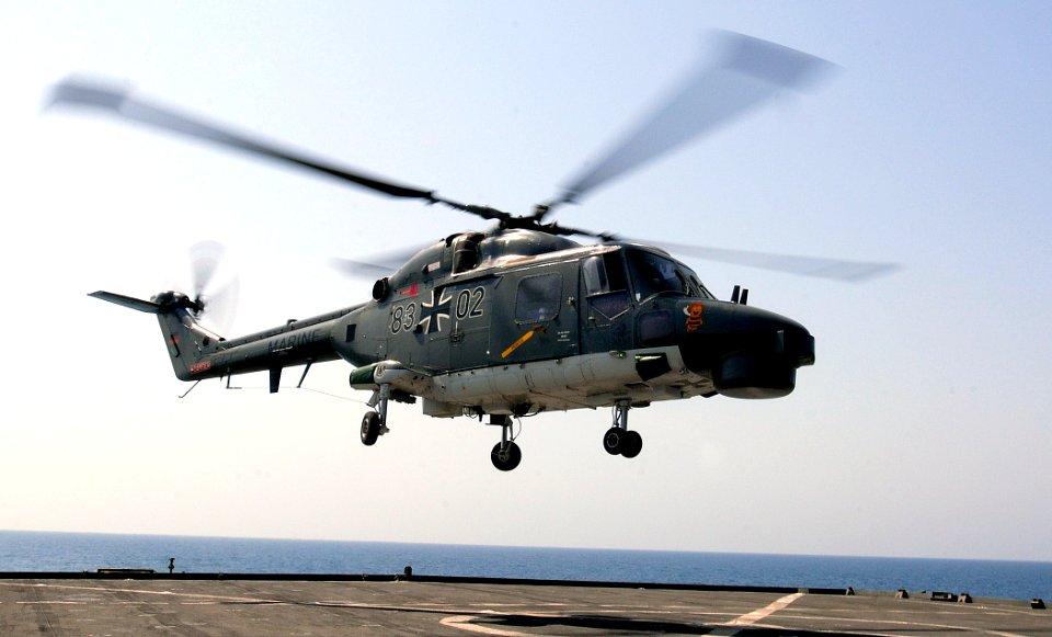 US Navy 110922-N-GH121-118 A German marine Lynx helicopter departs after receiving fuel aboard the amphibious dock landing ship USS Whidbey Island