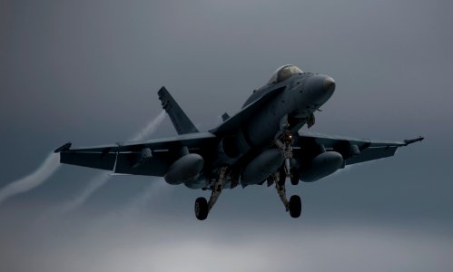 US Navy 110922-N-TU221-741 An F-A-18C Hornet assigned to Strike Fighter Squadron (VFA) 151 makes a landing approach towards the flight deck of the