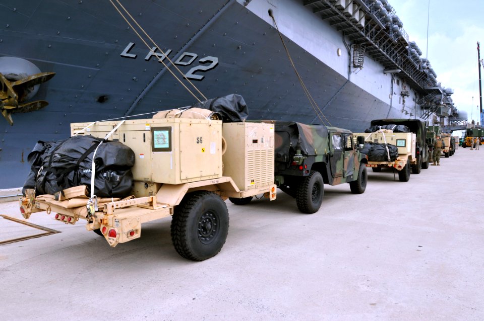 US Navy 110925-N-KM175-017 Vehicles and support gear assigned to the 31st MEU line the pier at White Beach Naval Facility Okinawa to be loaded aboa
