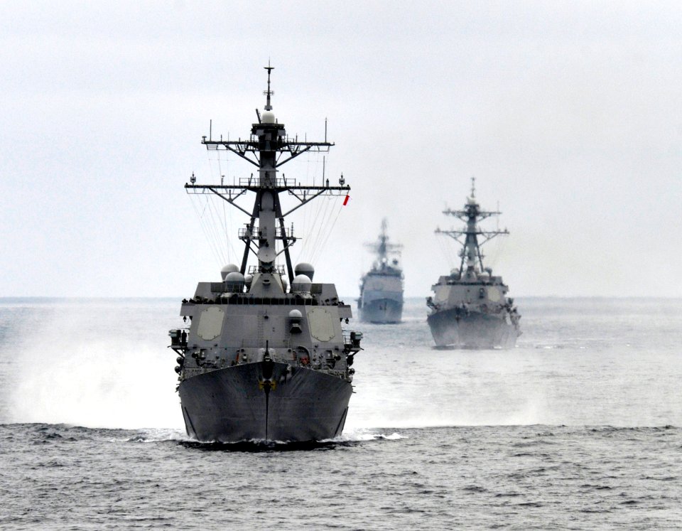 US Navy 110921-N-GZ277-022 The Arleigh Burke-class guided-missile destroyer USS Stockdale (DDG 106), left, the Ticonderoga-class guided-missile cru