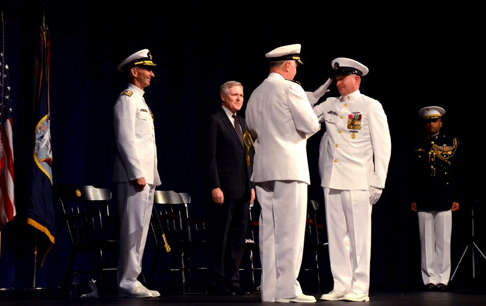 US Navy 110923-N-FC670-024 Master Chief Petty Officer of the Navy (MCPON) Rick West presents Adm. Gary Roughead with his flag