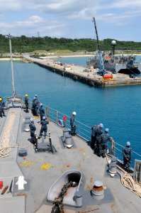US Navy 110923-N-MW330-311 Sailors aboard the amphibious dock landing ship USS Germantown (LSD 42) prepare to dock at West Army Pier in Okinawa, Ja