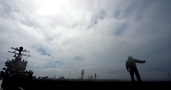 US Navy 110922-N-TU221-207 Sailors perform normal operations on the flight deck of the Nimitz-class aircraft carrier USS Abraham Lincoln (CVN 72) photo