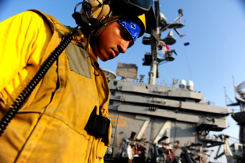 US Navy 110925-N-VN693-266 Aviation Boatswain's Mate (Handling) Airman Apprentice Terrance Wever, from Charleston, S.C., participates