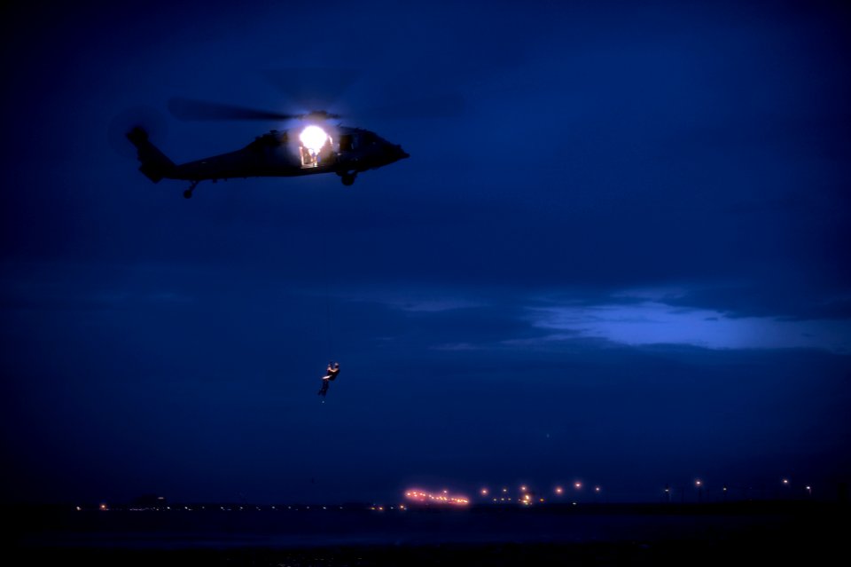 US Navy 110921-N-XZ912-085 Members of Helicopter Sea Combat Squadron (HSC) 7 perform a night search and rescue jump for qualification
