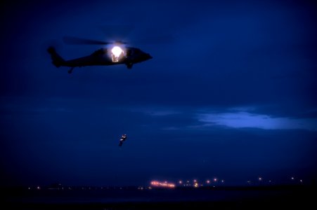 US Navy 110921-N-XZ912-085 Members of Helicopter Sea Combat Squadron (HSC) 7 perform a night search and rescue jump for qualification