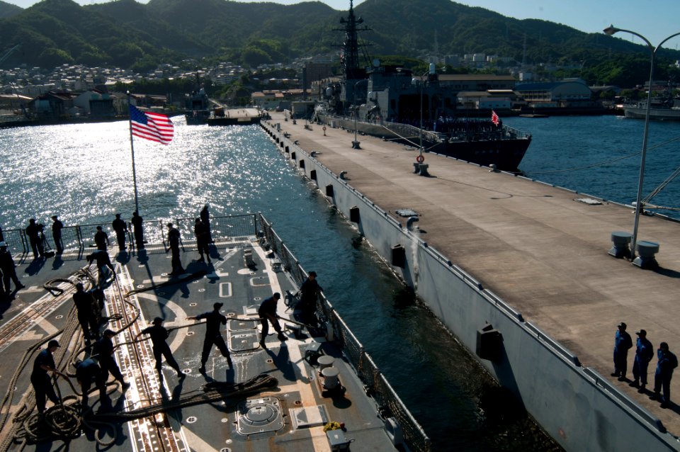 US Navy 110922-N-EA192-008 Sailors assigned to the guided-missile destroyer USS Mustin (DDG 89) handle lines as the ship gets underway from the Jap