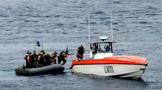 US Navy 110926-N-BC134-035 The visit, board, search and seizure (VBSS) team assigned to the guided-missile cruiser USS Bunker Hill (CG 52) boards a photo