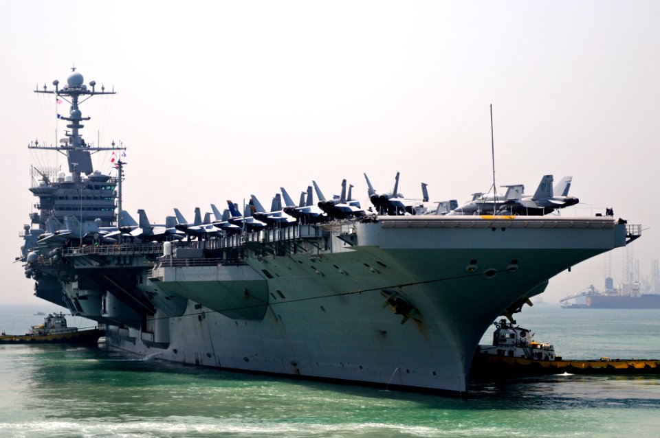 US Navy 110925-N-YM590-075 The Nimitz-class aircraft carrier USS John C. Stennis (CVN 74) departs Manama, Bahrain, after a scheduled port visit