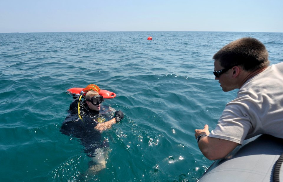 US Navy 110922-N-IR479-104 Explosive Ordnance Disposal Technician 1st Class Carey Peekstok, left, and Explosive Ordnance Disposal Technician 2nd Cl