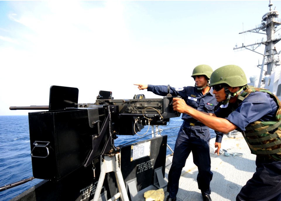 US Navy 110922-N-KK935-952 Bangladesh navy sailors riding the guided-missile destroyer USS Kidd (DDG 100) scope out a practice target before a live