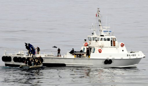 US Navy 110926-N-BC134-146 The visit, board, search and seizure (VBSS) team assigned to the guided-missile cruiser USS Bunker Hill (CG 52) boards a