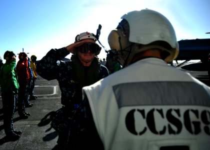 US Navy 110926-N-YB753-016 Vice Adm. Gerald Beaman returns a hand salute to Rear Adm. Troy Mike Shoemaker as he boards USS Abraham Lincoln (CVN 72) photo