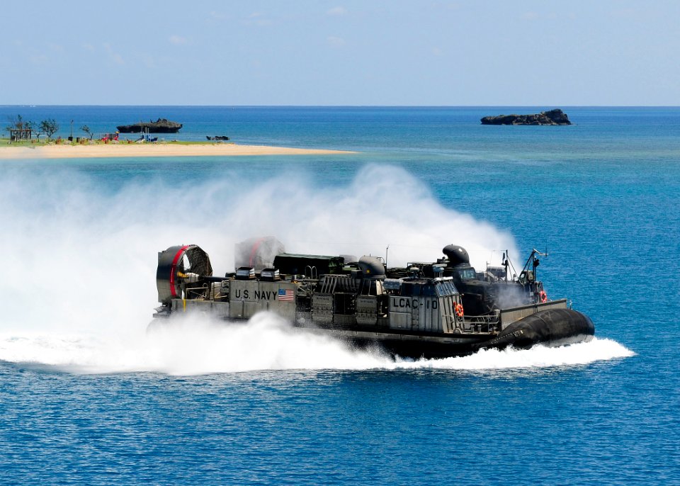 US Navy 110923-N-WJ771-104 A landing craft air cushion carrying equipment assigned to the 31st MEU approaches the well deck of USS Denver (LPD 9)