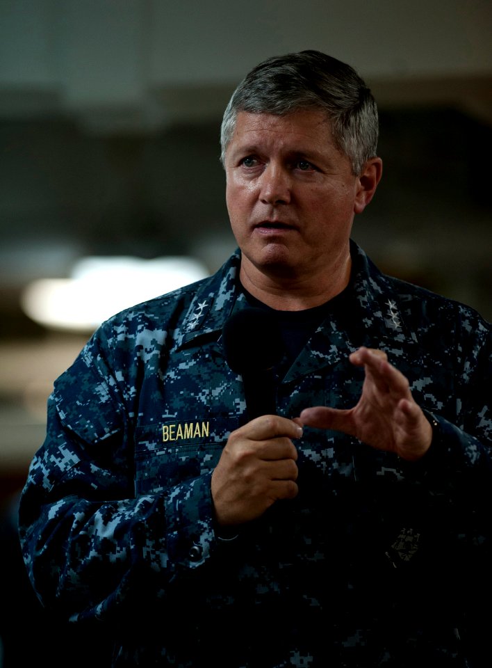 US Navy 110926-N-DR144-233 Vice Adm. Gerald R. Beaman speaks to Sailors during an all-hands call on the mess decks aboard USS Carl Vinson (CVN 70)