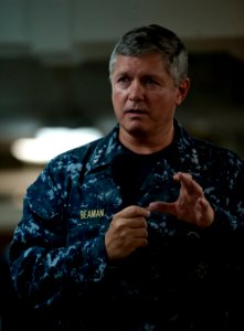 US Navy 110926-N-DR144-233 Vice Adm. Gerald R. Beaman speaks to Sailors during an all-hands call on the mess decks aboard USS Carl Vinson (CVN 70)
