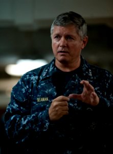 US Navy 110926-N-DR144-233 Vice Adm. Gerald R. Beaman speaks to Sailors during an all-hands call on the mess decks aboard USS Carl Vinson (CVN 70) photo